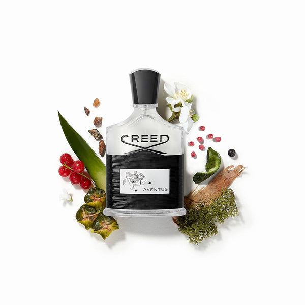 Creed Aventus bottle surrounded by its raw ingredients